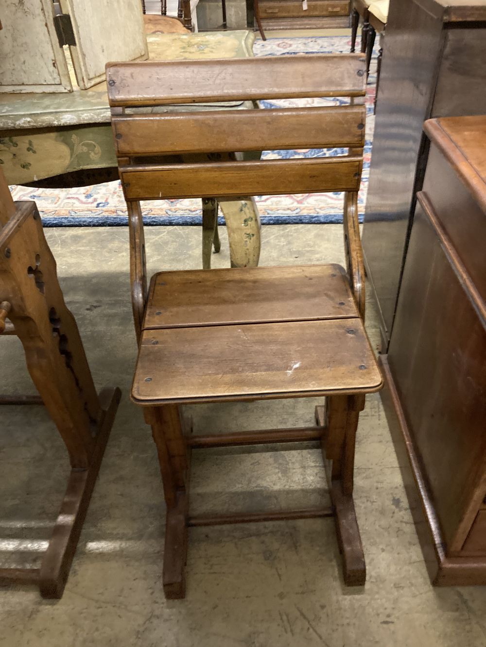 A 19th century Continental oak metamorphic rise and fall students desk together with a matching chair, desk width 66cm